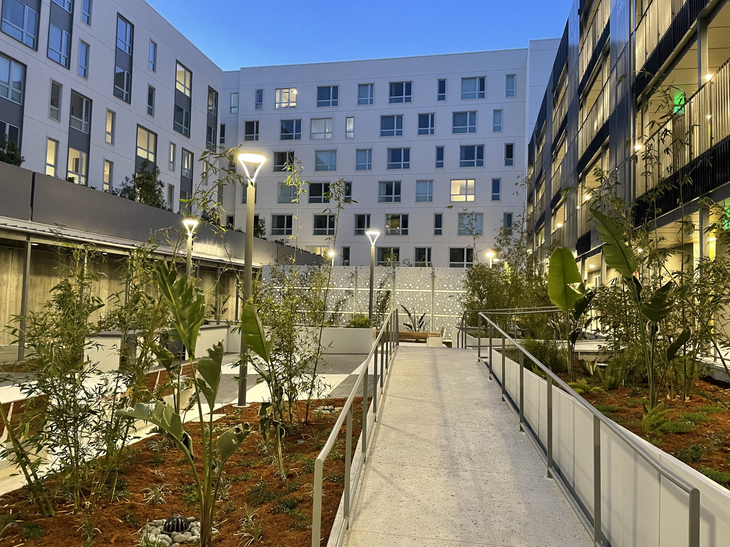 The courtyard is a daytime and evening hangout and event space for tenants, and connects the four residential wings of the complex. Sister Lillian Murphy Community, Mission Bay. San Francisco, California © Karl Vinge
