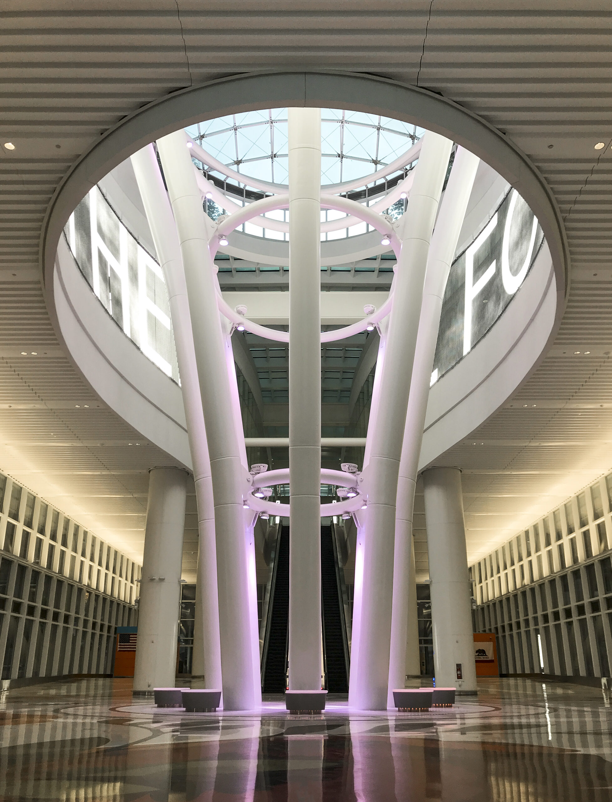 The Light Column extends from the roof deck to two stories below grade and is illuminated with a different color every hour. Salesforce Transit Center (Phase One), San Francisco, California © Apeiro Design