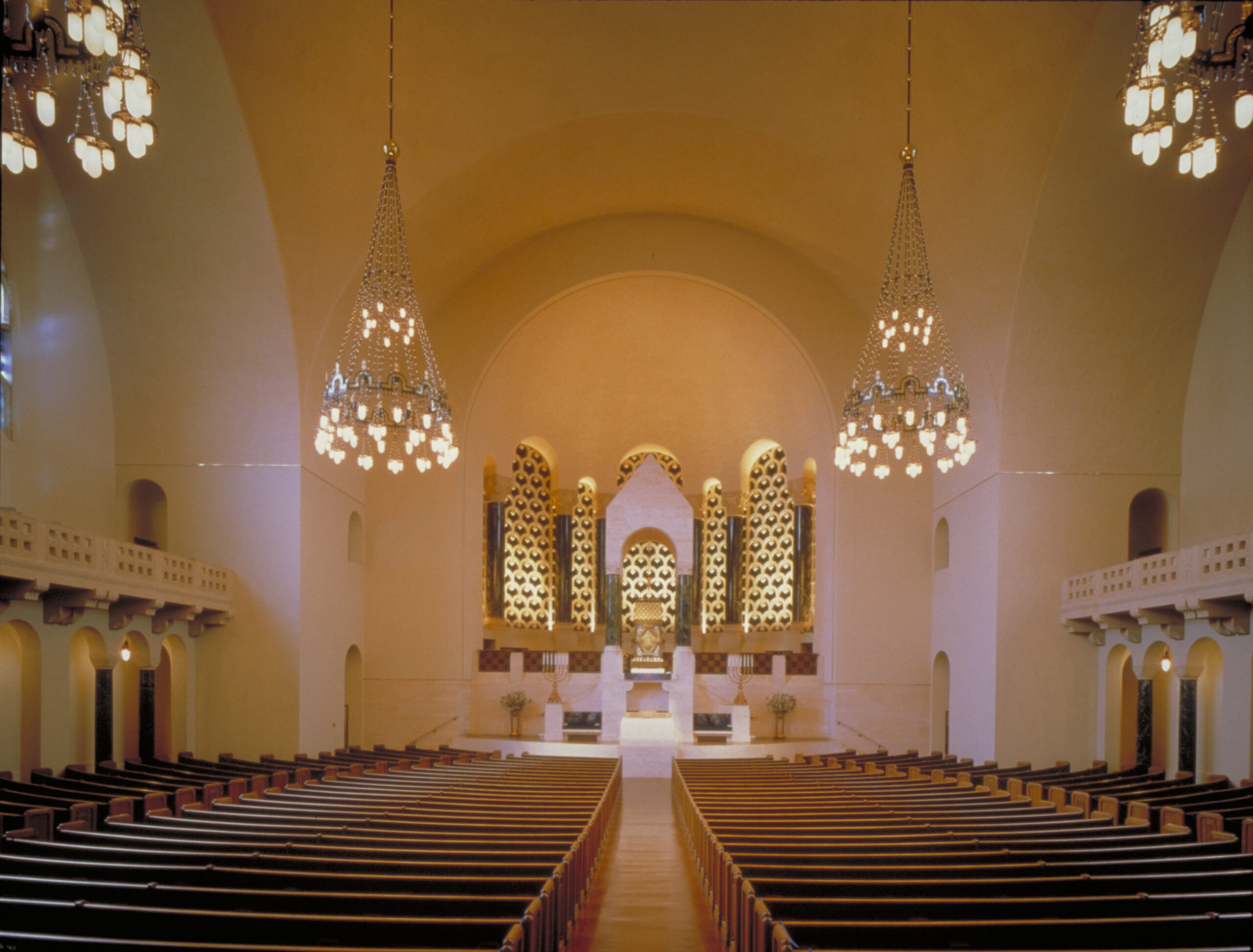 Lighting for the historic main sanctuary was completely renovated using both architectural and theatrical lighting techniques. A ceiling oculus was added to light the bimah and provide adequate light for the congregation. Temple Emanu-El, San Francisco, California © Chas McGrath