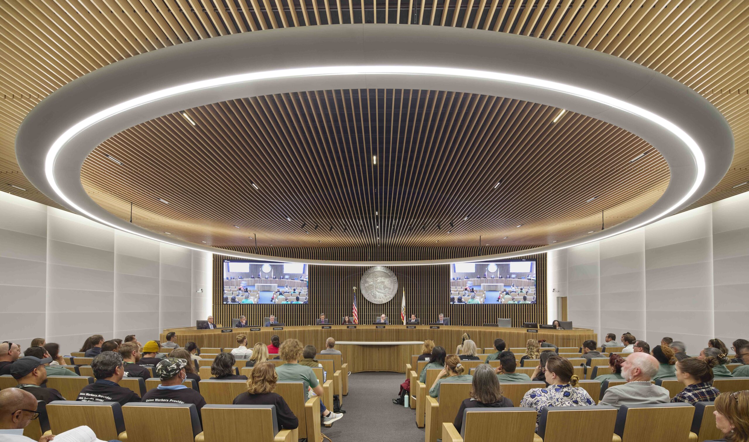 Wide view of the inclusive and light-filled Board Chambers, the architectural centerpiece of San Mateo County’s net-zero-energy government building.