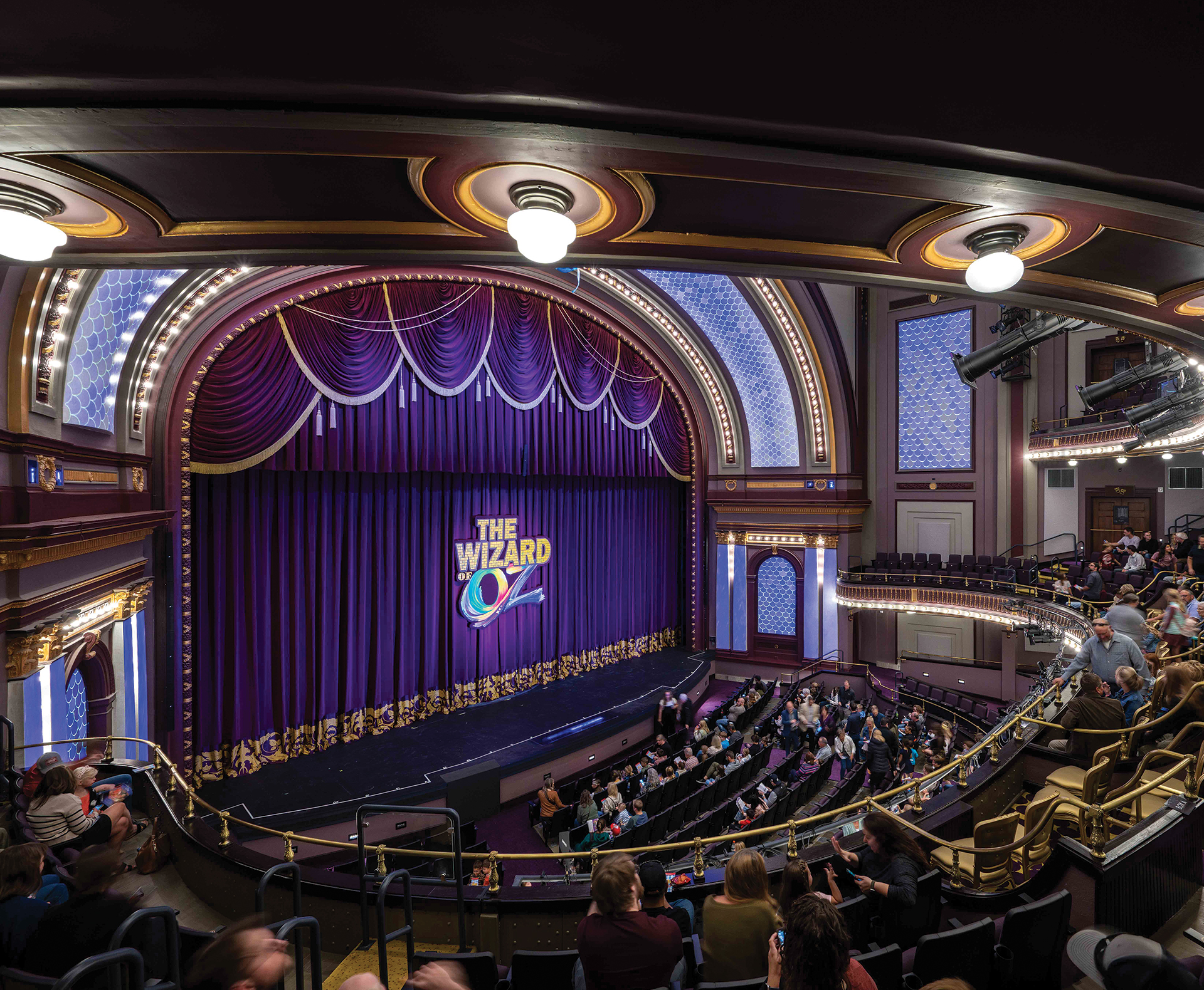 Interior of the renovated auditorium at The Children’s Theatre of Cincinnati, featuring upgraded lighting, preserved historic detailing, and immersive stage technology.